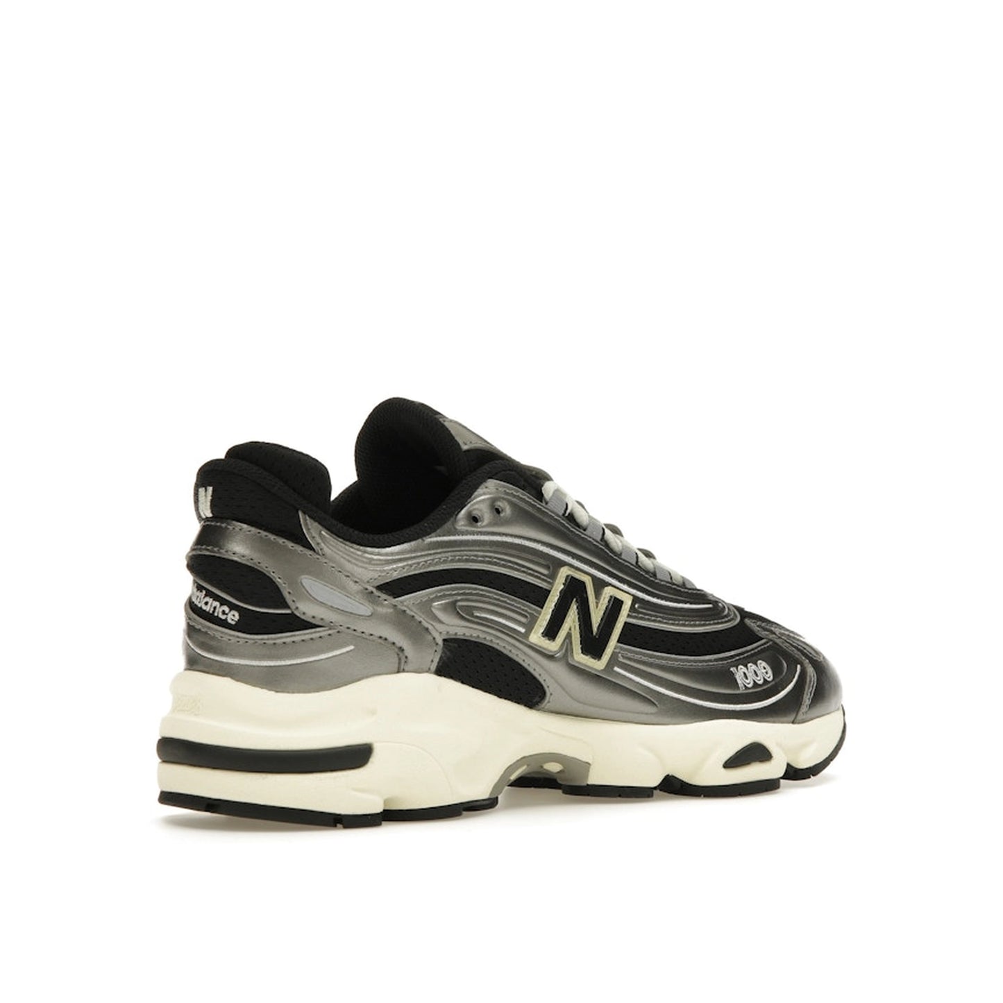 New Balance 1000 sneakers, back view, model M1000SL, silver metallic with grey accents.