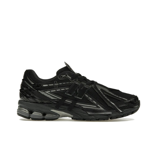 New Balance 1906A men’s black sneaker with dark silver metallic accents, textile and denim.
