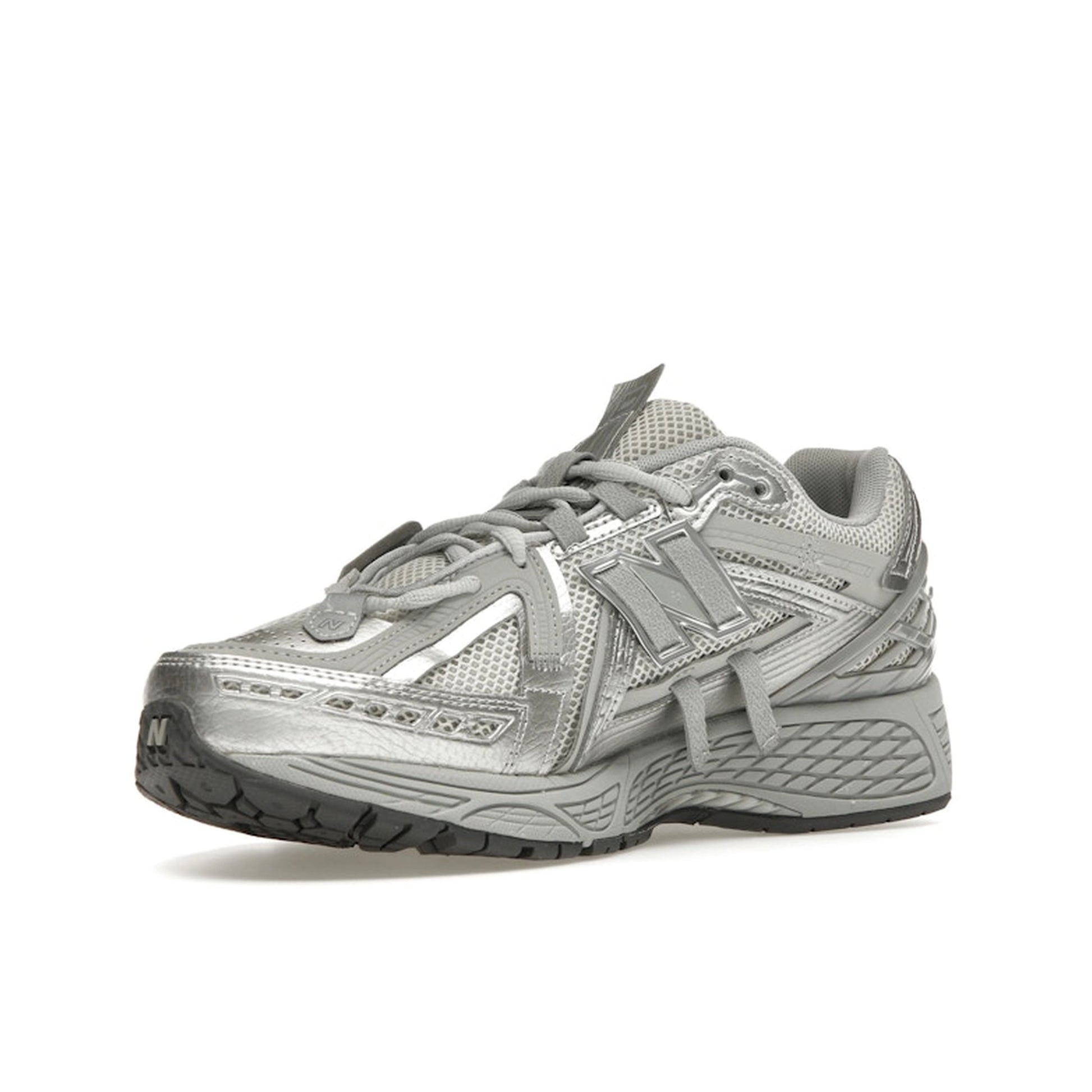 New Balance 1906A Concrete Silver Metallic, front view, layered silver panels with reflective details.