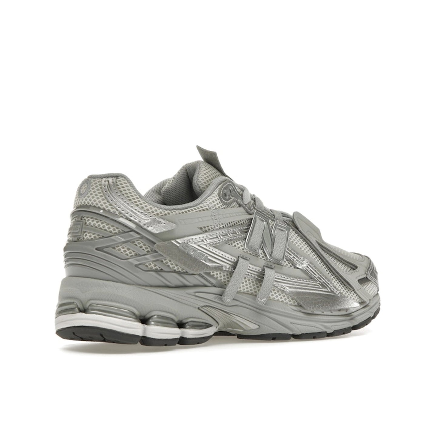 New Balance 1906A Concrete Silver Metallic, back view, layered silver panels with reflective details.