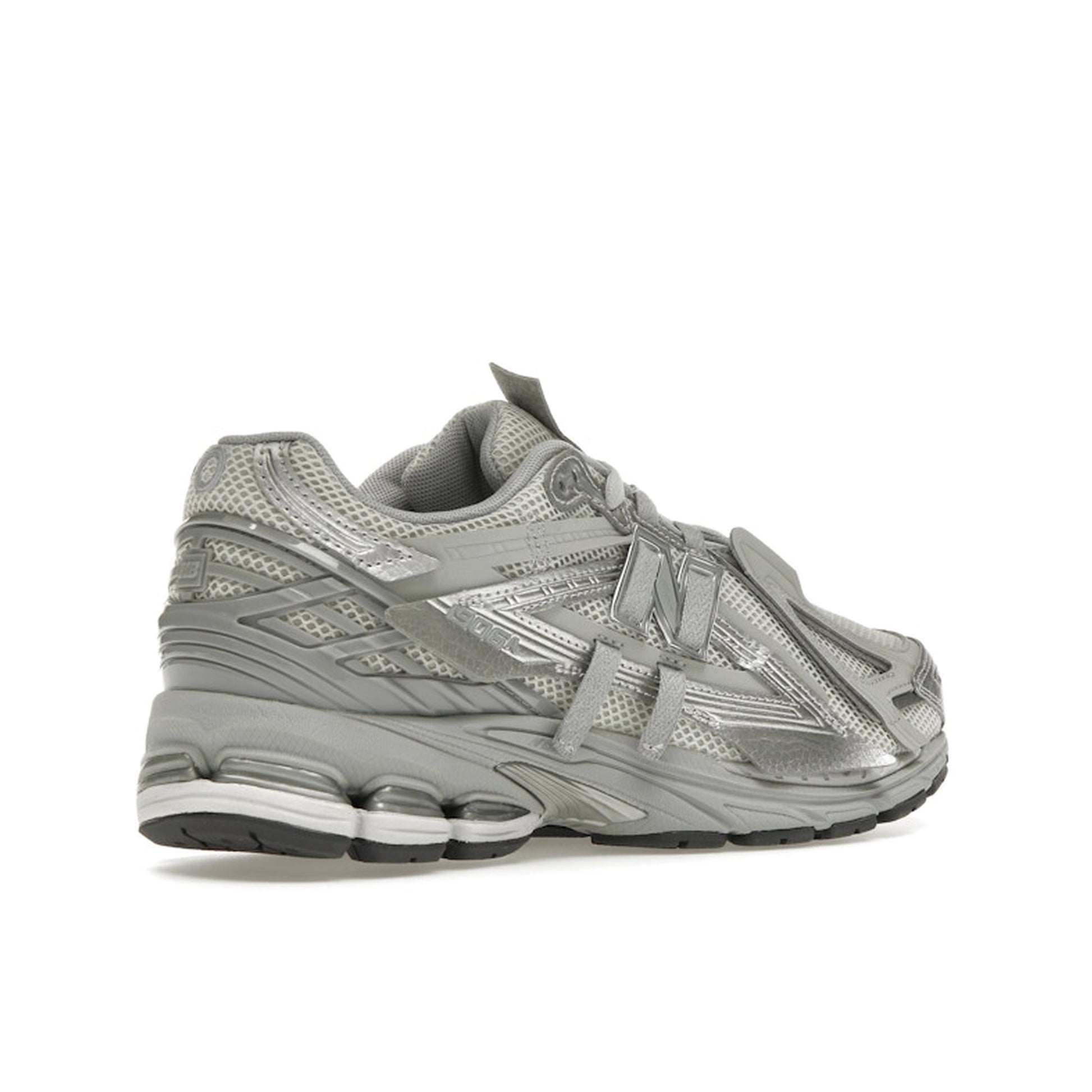 New Balance 1906A Concrete Silver Metallic, back view, layered silver panels with reflective details.