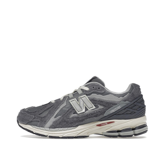 New Balance 1906D Protection Pack sneakers, side view, model M1906DA in harbor grey with black and white details.