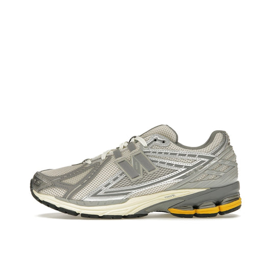 New Balance 1906 sneakers, side view, in breathable mesh upper with moonbeam and raincloud colorway.