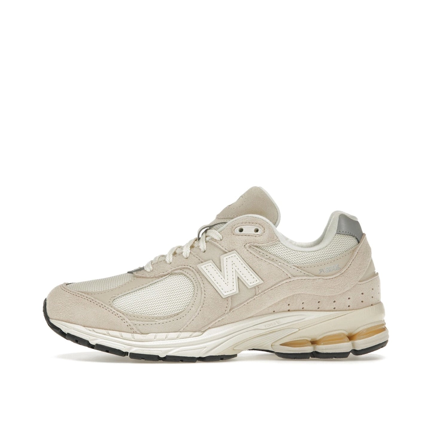 New Balance 2002R sneakers, side view, model M2002RCC, in off-white with subtle detailing.