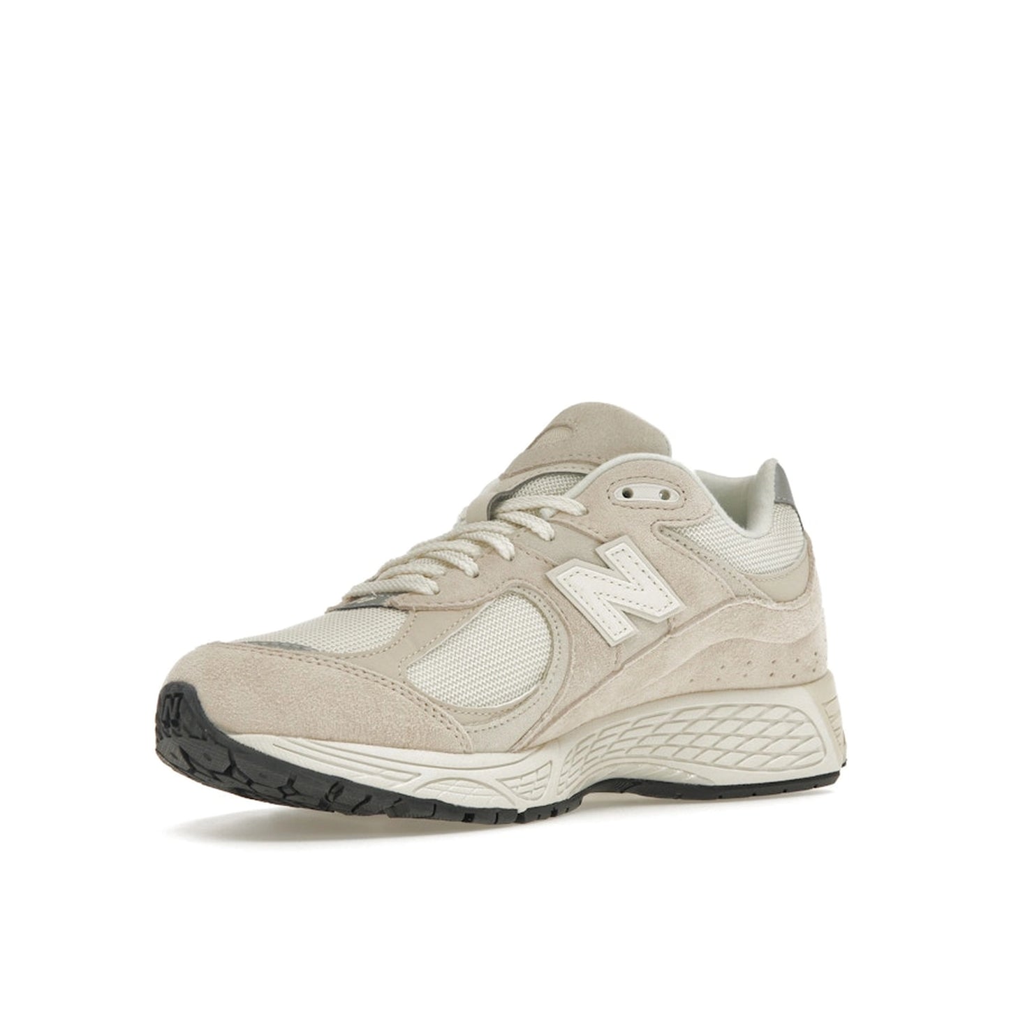 New Balance 2002R sneakers, front view, model M2002RCC, in off-white with subtle detailing.