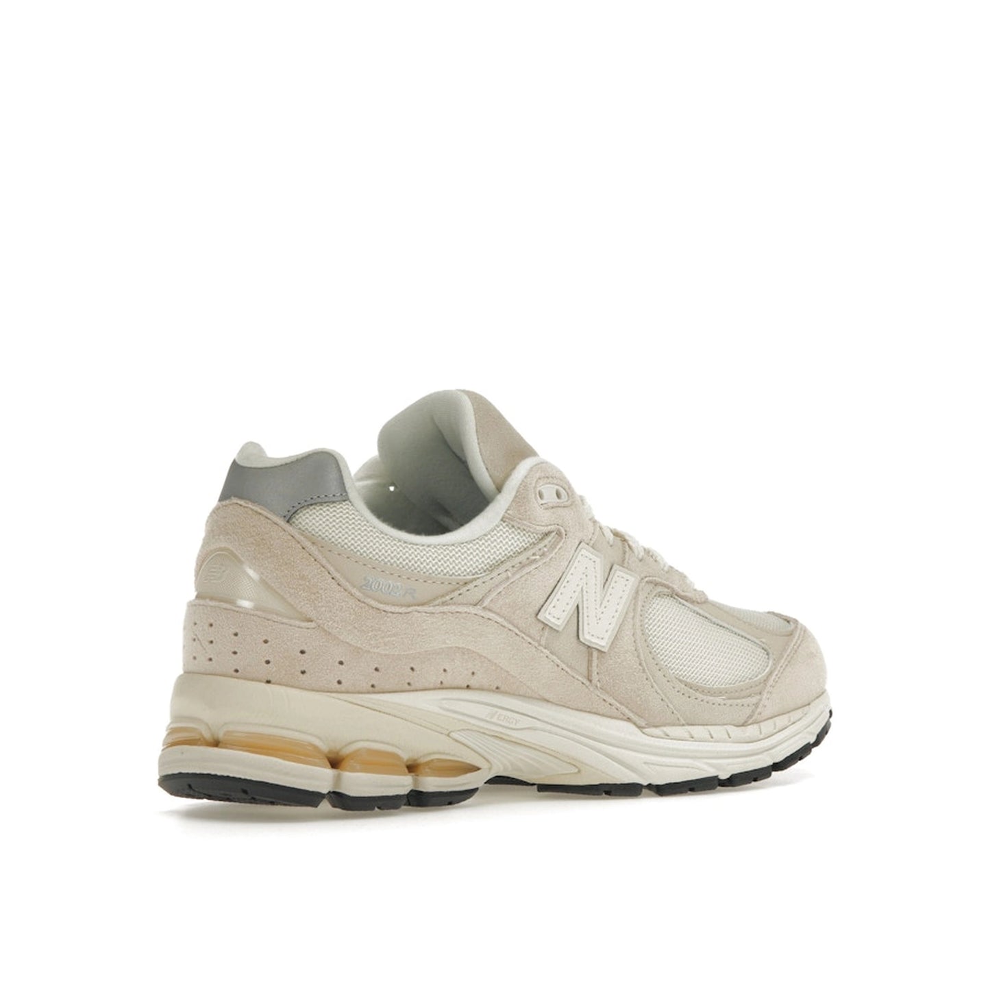 New Balance 2002R sneakers, back view, model M2002RCC, in off-white with subtle detailing.