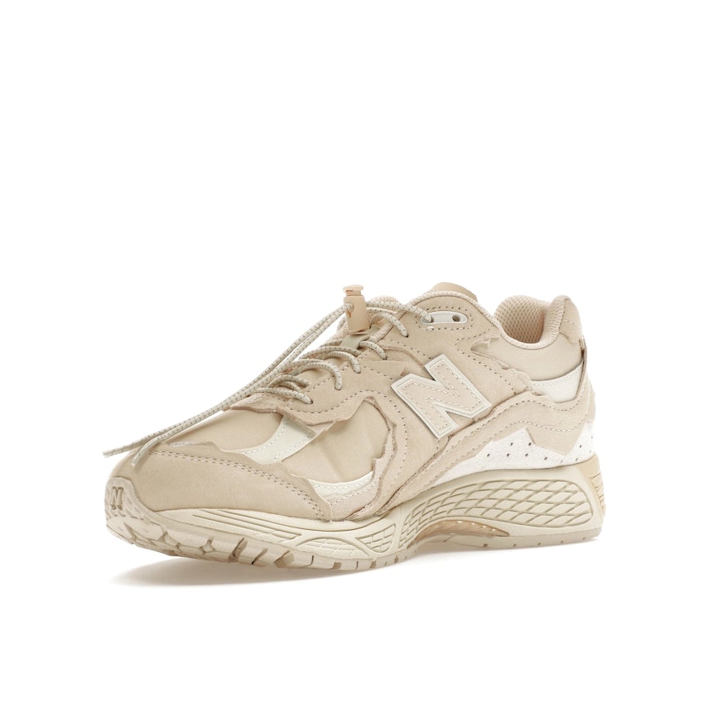 New Balance 2002R Protection Pack sneakers in Sandstone, front view, model M2002RDQ in beige.