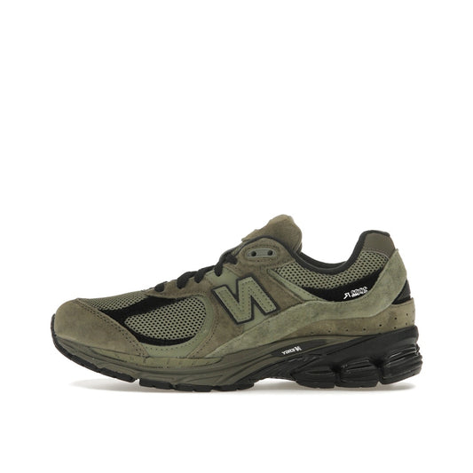 New Balance 2002R sneakers, side view, in dark camo with tonal olive suede and mesh.