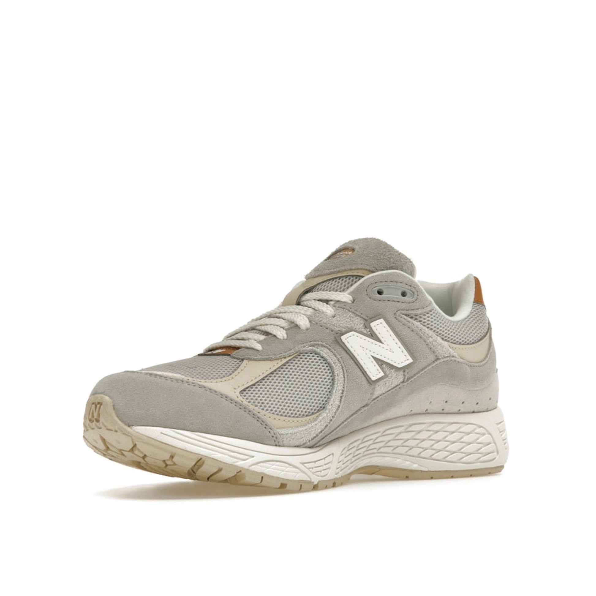 New Balance 2002R Concrete Grey sneakers, front view, in grey with tonal overlays.