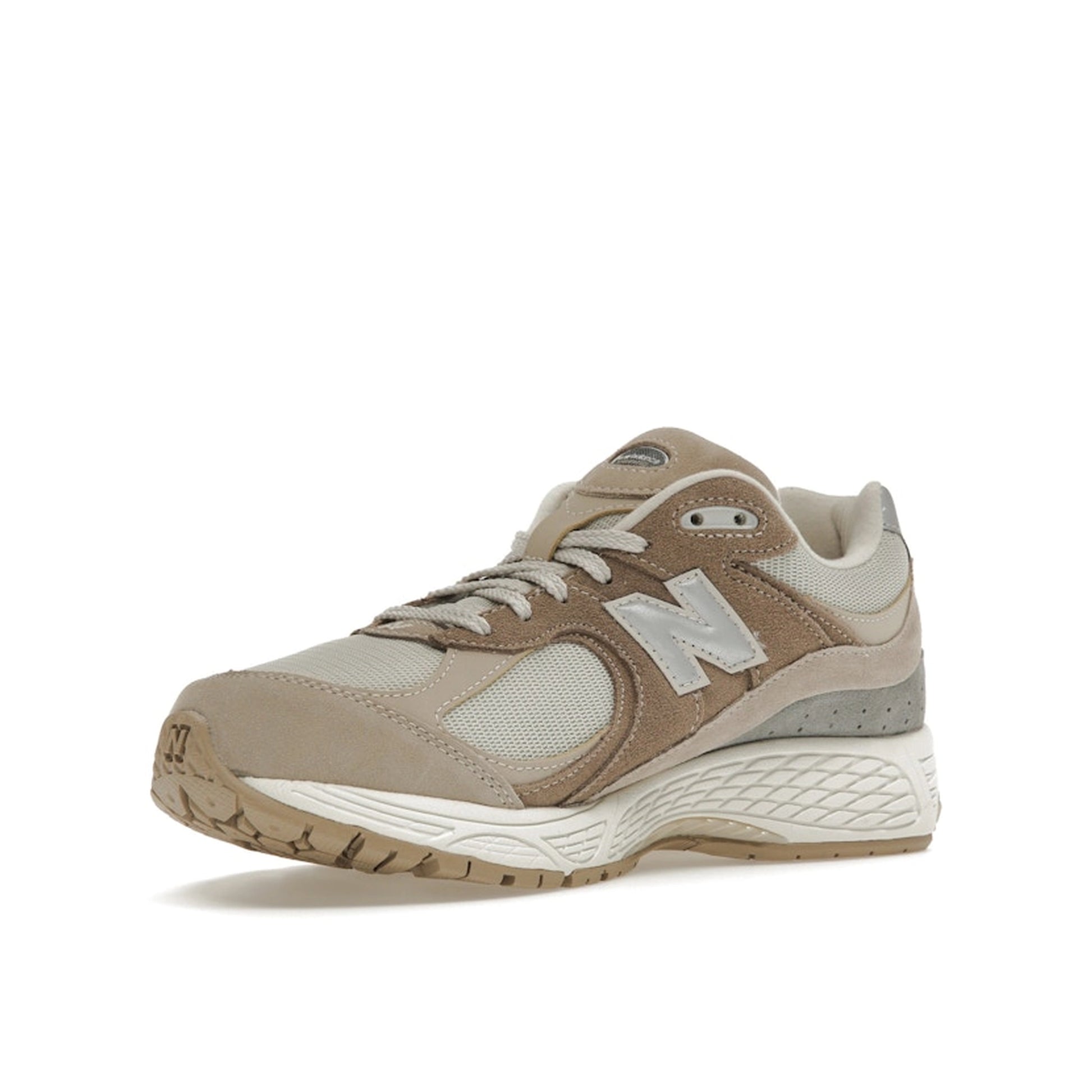 New Balance 2002R Driftwood Sandstone sneakers, front view, in beige and tan tones.