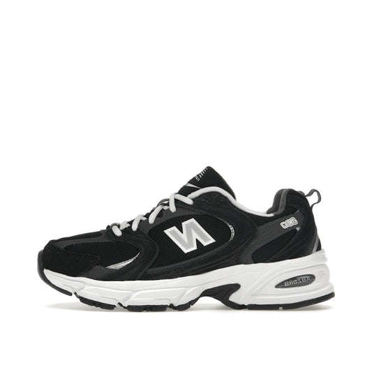 New Balance 530 Classic, side view, in black with silver and grey details.