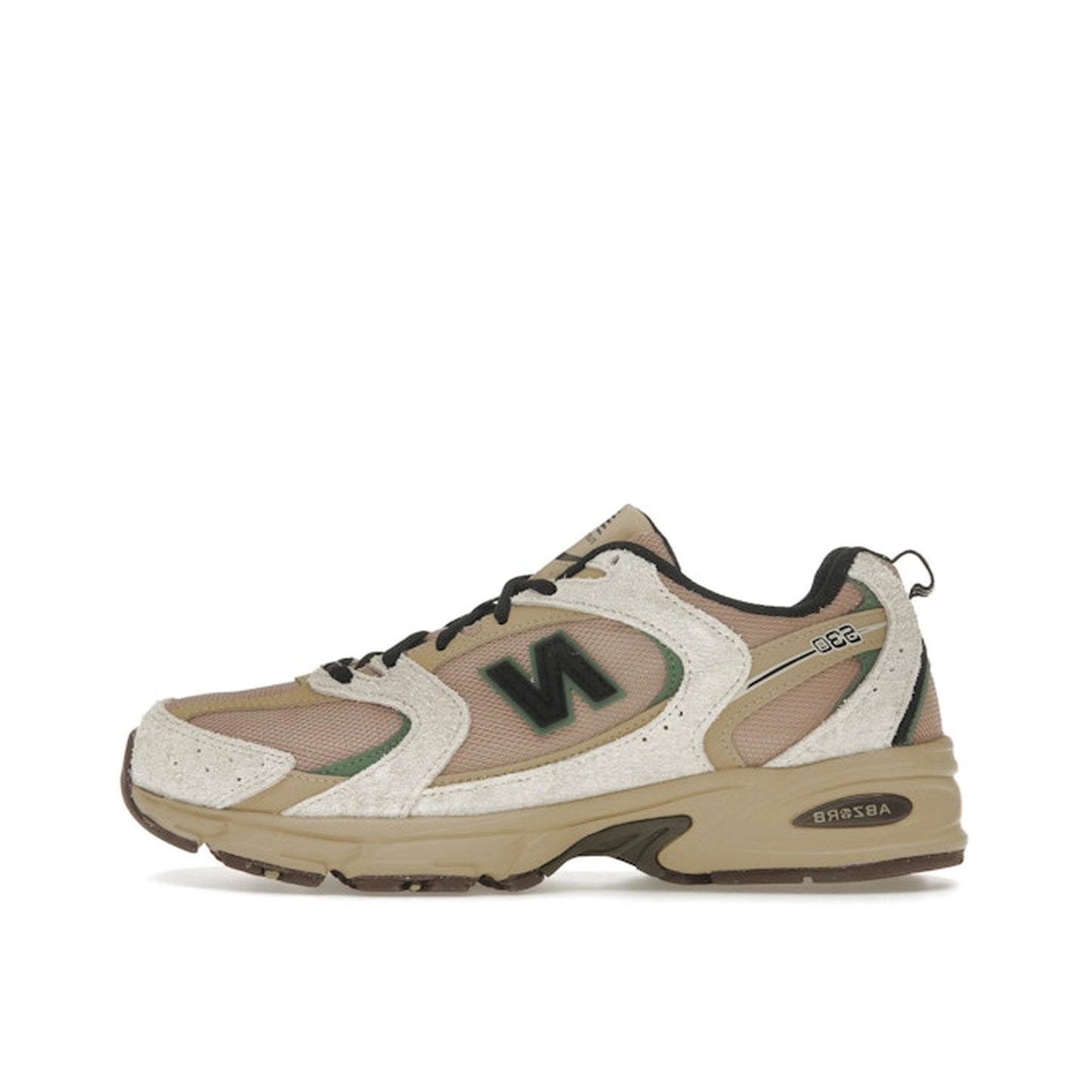 New Balance 530, side view, in linen and incense tones with mesh and suede overlays.