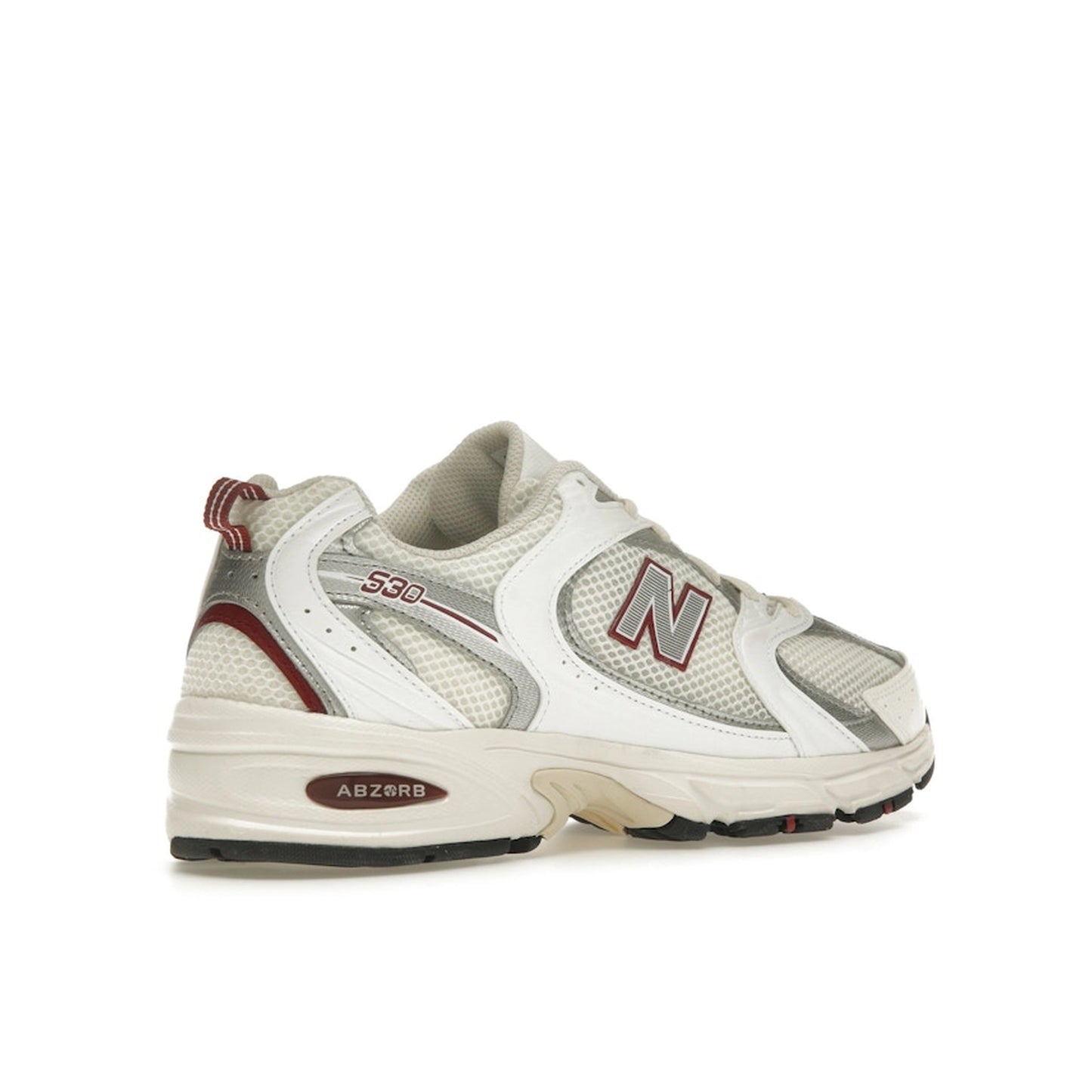 New Balance 530 sneakers, back view, in sea salt with mercury red accents.