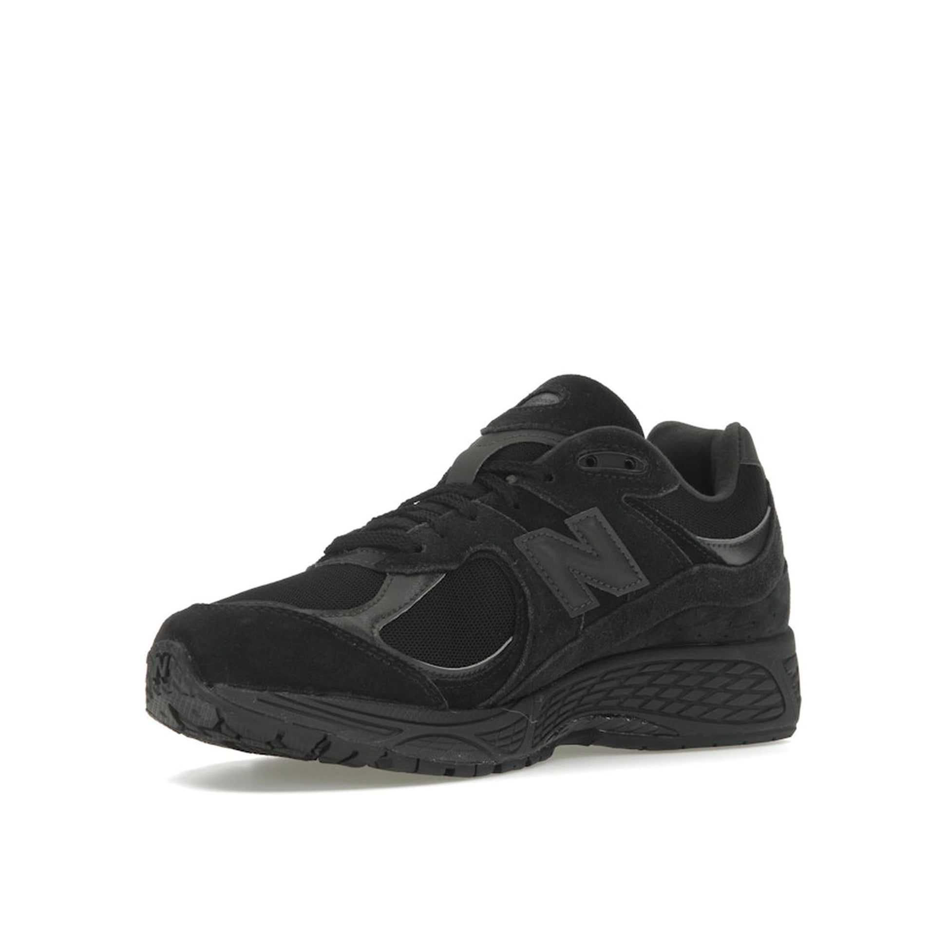 New Balance 2002R sneakers, front view, in triple black suede with tonal sole.