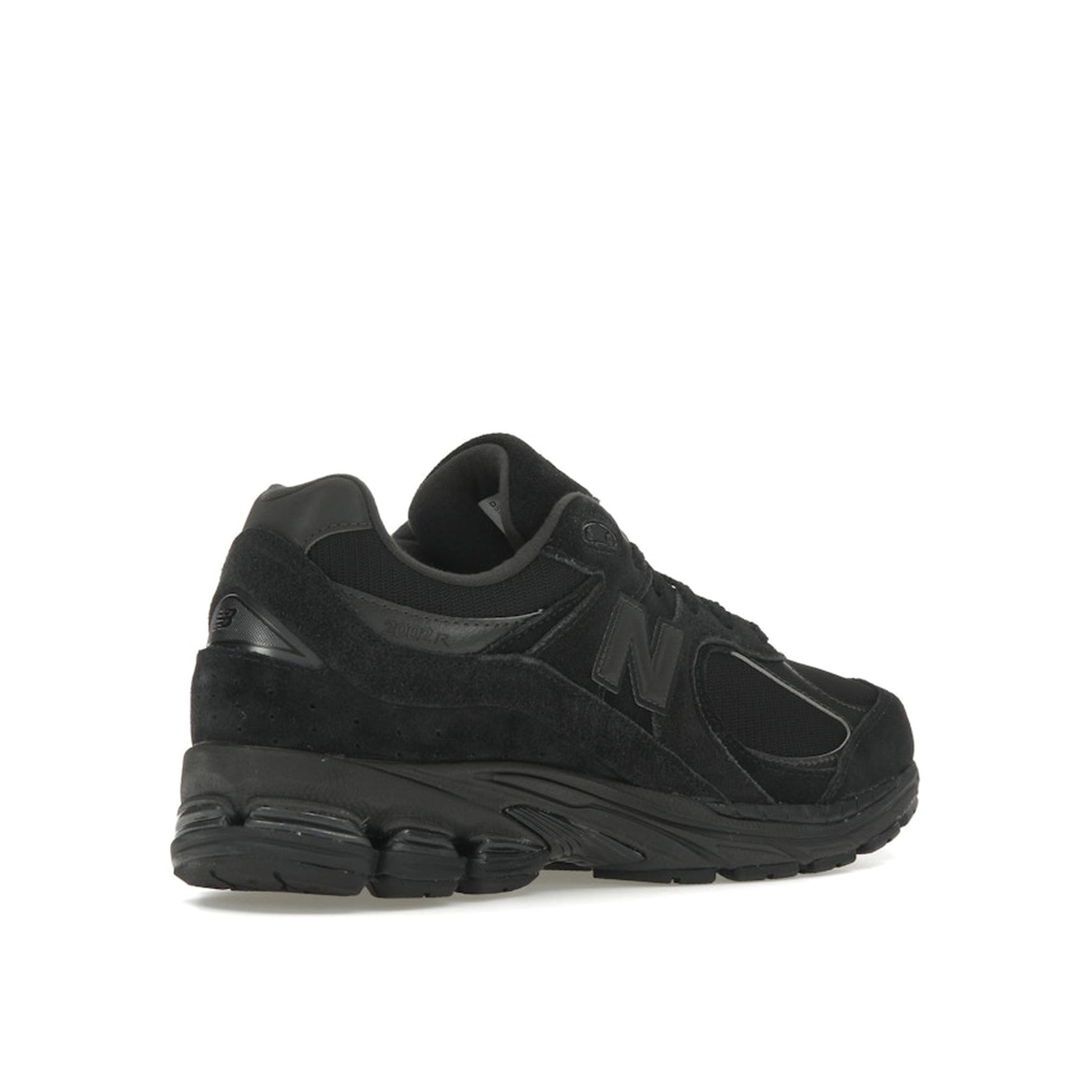 New Balance 2002R sneakers, back view, in triple black suede with tonal sole.