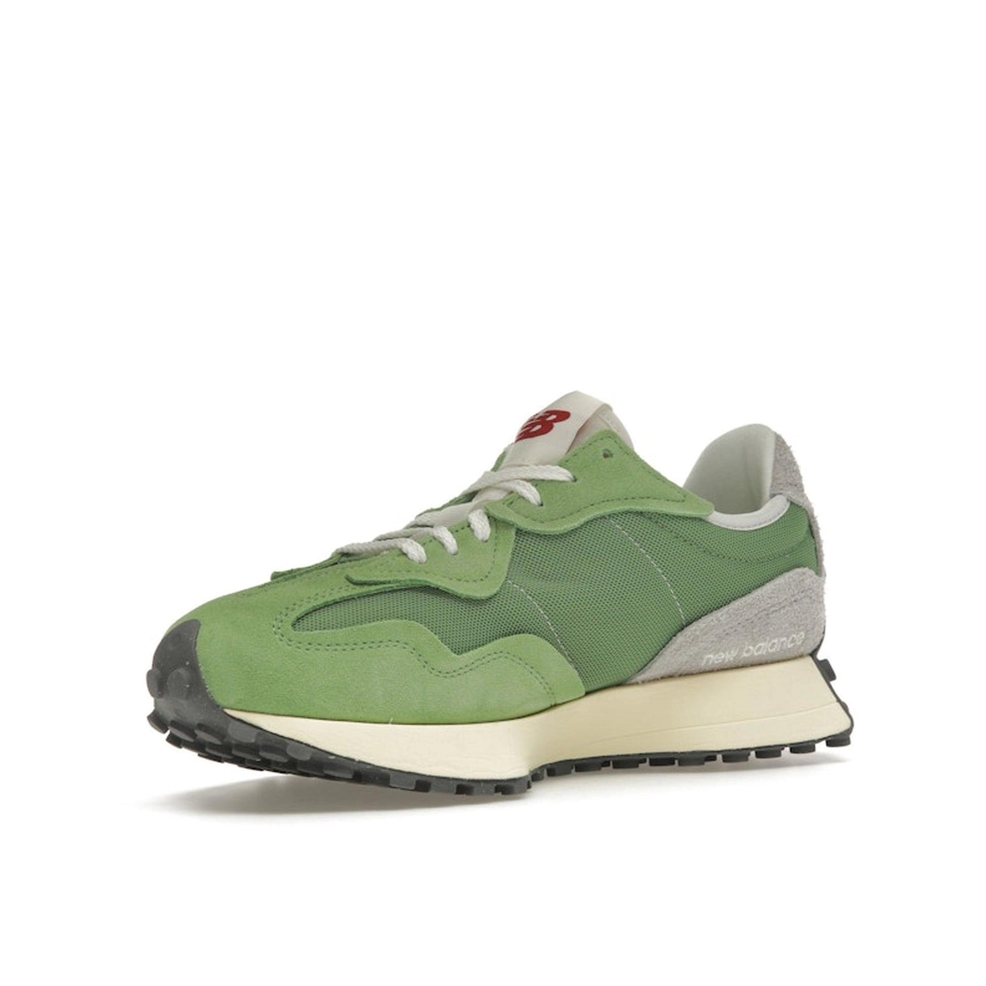 New Balance 327 sneakers, front view, in chive green and avocado with white details.