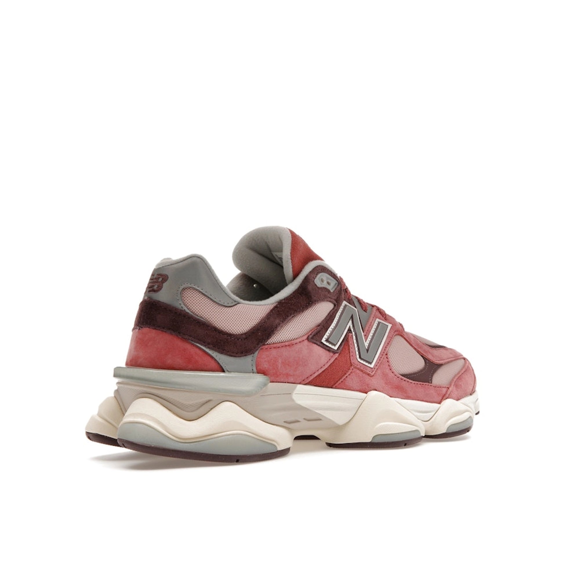 New Balance 9060 sneakers, back view, model U9060TRU in cherry blossom with beige and white details.